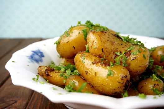 Roasted potatoes. Healthy sidedish with parsley garnish