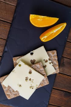 Crispy rye bread with cheese and orange