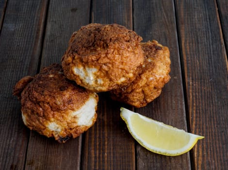 Fresh fried fish cakes served with lemon