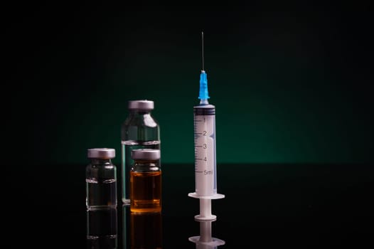 Syringe and medical vials with green backlight