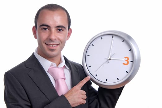 A handsome business man holding a clock