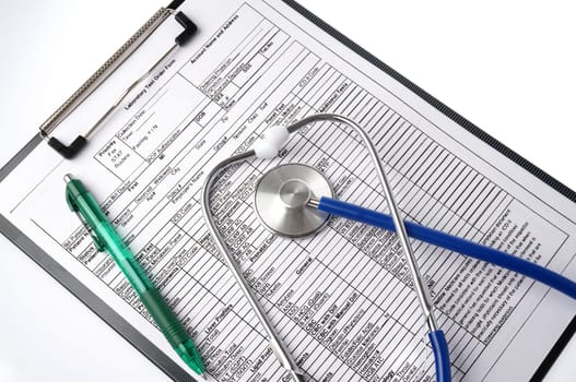 Medical chart with stethoscope and pen, ready to fill