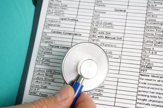 Doctor, hospital staff with medical chart and stethoscope