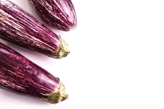 Raw ripe Striped healthy eggplants, isolated on white