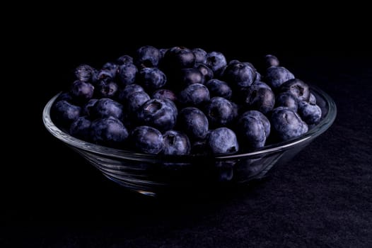 Blueberry in a glass bowl isolated on Black