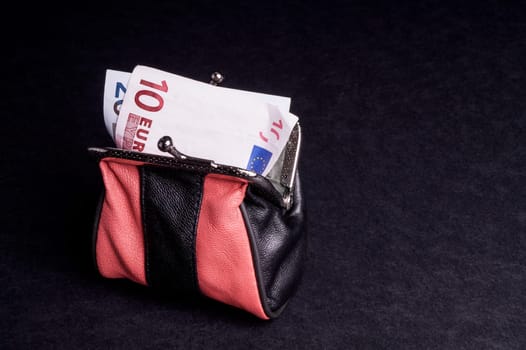 Money in the Purse, with copy space and isolated on Black