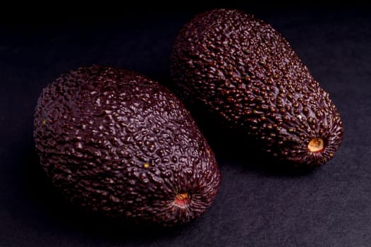 Whole Organic Ripe Avocado Isolated on Black