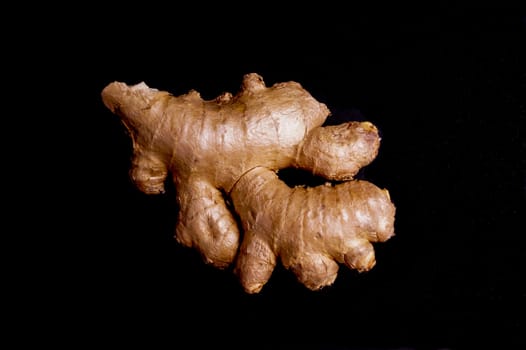 Fresh healthy ginger Root isolated on Black