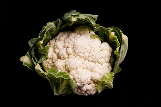 Healthy Organic Cauliflower isolated on black background