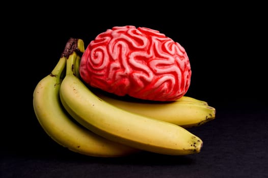 Feeding the Brain with Healthy Food for Energy isolated on Black