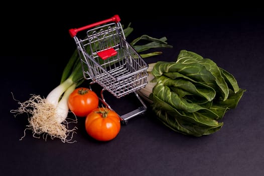 Chopping Cart with vegetable isolated on Black