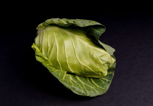 Healthy Fresh Spring Cabbage isolated on Black