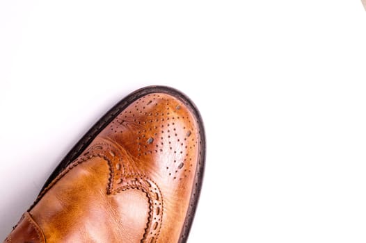 Elegant gentleman Leather Shoe. Brown elegant men's shoes ready to use for a gentleman rendezvous or business meeting. Isolated on white