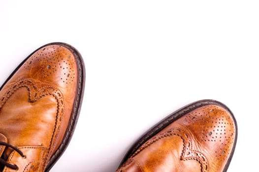 Elegant gentleman Leather Shoe. Brown elegant men's shoes ready to use for a gentleman rendezvous or business meeting. Isolated on white