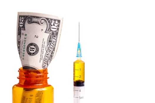 Money in a prescription Medicin Bottle. Both Prescription and Drugs cost a lot of money