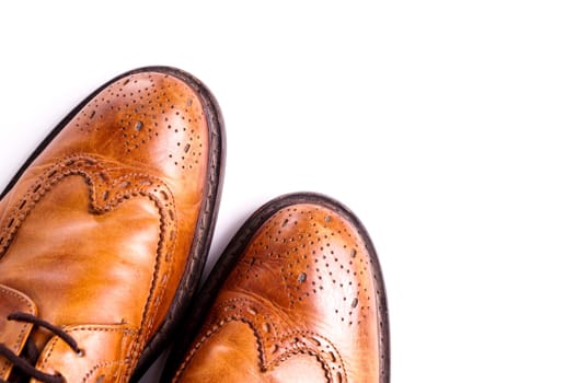 Elegant gentleman Leather Shoe. Brown elegant men's shoes ready to use for a gentleman rendezvous or business meeting. Isolated on white