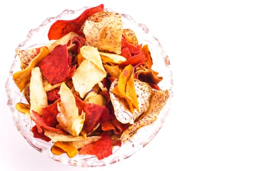 Crispy Colorful Root Vegetable chips, Isolated on white with copy space