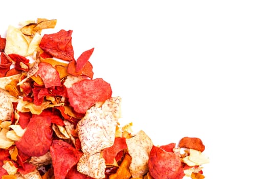 Crispy Colorful Root Vegetable chips, isolated on white with copyspace