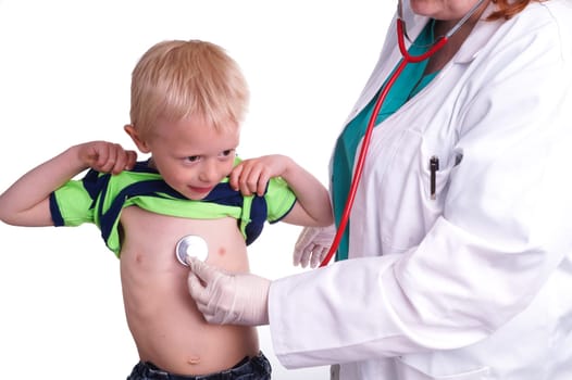 Doctor examines a young child. The doctor examines the child and listening to the heart and lungs with her stethoscope. He helps doctor by lift his shirt up so the nurse can come to listen to the boy's chest