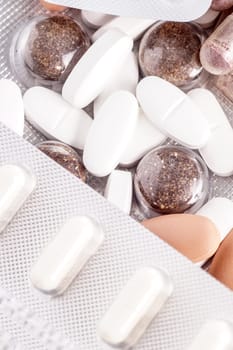 Medicine pills and tablets lying in a pile