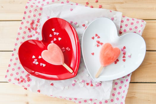 Ice cream on the stem in heart shape on heart plate