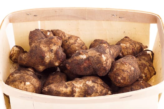 basket with pile of healthy organic Jerusalem artichoke