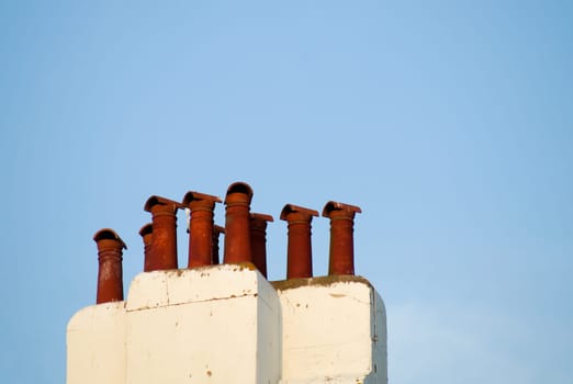 the City chimneys against the blue clear sky