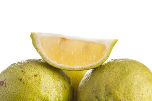 Slice of Green Lemon, isolated on white