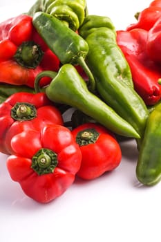 Bunch of different peppers, red, green and red isolated on white