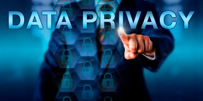 Businessman presses DATA PRIVACY on a touch screen display. locked padlock icons in hexagons represent protected data sets. Business metaphor and technology concept for information protection.