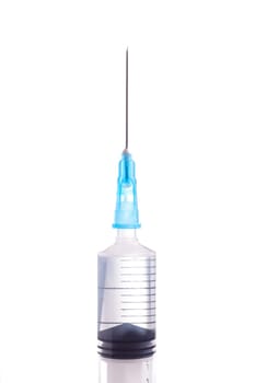 Syringe and needle filled with liquid, isolated on white