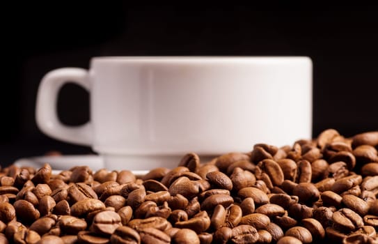 Coffee in a cup and a pile of Coffee Beans