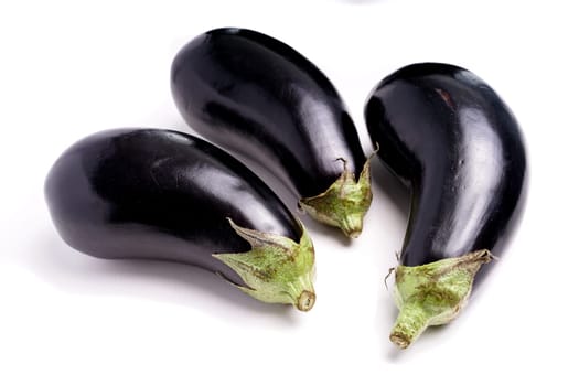 Three Healthy Organic Purple Eggplant, isolated on white