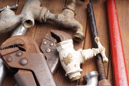 plumbing tools lying with old pipes and faucets