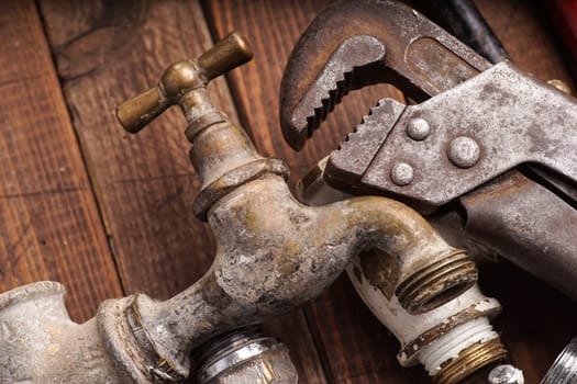 plumbing tools lying with old pipes and faucets