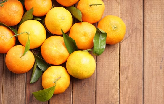 fresh organic clementines picked with green leaves