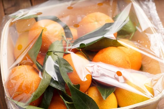 fresh organic clementines picked with green leaves