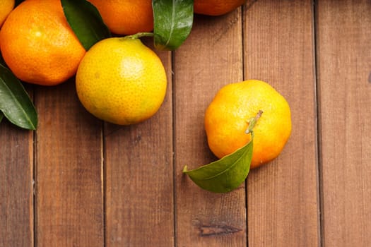 fresh organic clementines picked with green leaves