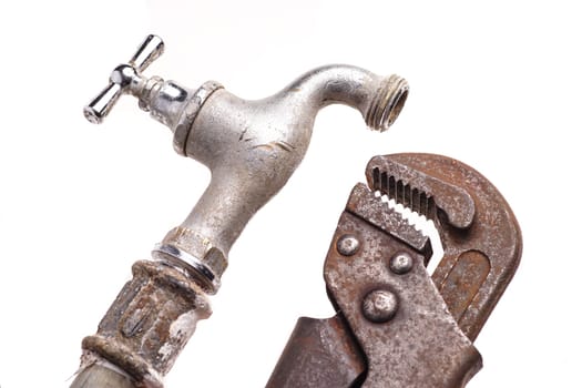plumbing tools lying with old pipes and faucets