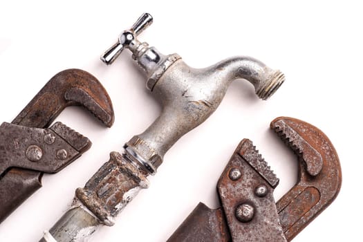plumbing tools lying with old pipes and faucets