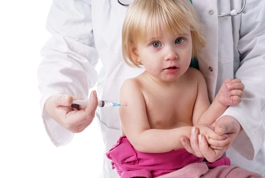 Doctor gives baby girl an injection. little girl is given an injection by the family doctor. The doctor gives the child an injection in the upper arm . It can be both a vaccination or as part of the girl&#39 s medical treatment