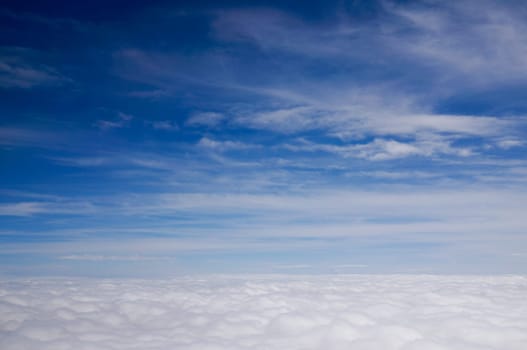 Above the Clouds Looking down on the skies with clear blue Heaven