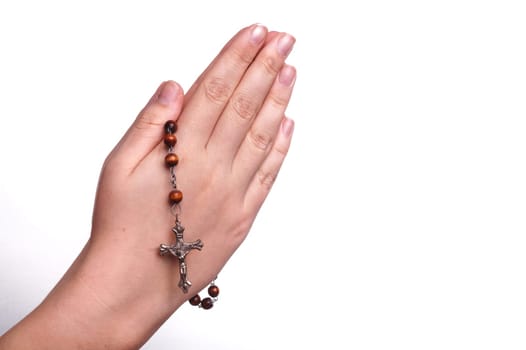 Hands of a woman Praying with Rosary, isoalted on white