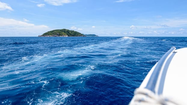 Travel by speed boat to islands in the beautiful landscape of blue sea and sky during summer at Mu Ko Similan National Park, Phang Nga province, Thailand, 16
