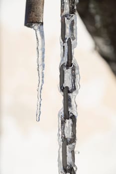 Chain Covered in Ice with an Icicle to the side.