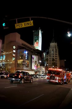 Los Angeles,United States - December 27,2015: A fire truck was on the nightly hollywood boulevard with traffic on December 27,2015 in Los Angeles.
