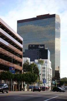 Los Angeles,United States - December 27,2015: The World Savings skyscraper and office buildings and shopping malls on Wilshire Boulevard with traffic on December 27,2015 in Los Angeles.