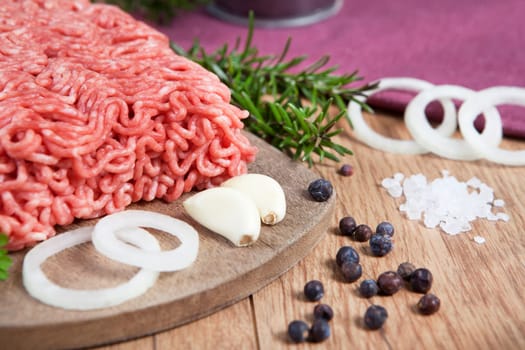 raw mixed minced pork and beef fresh on a wooden board with ingredients