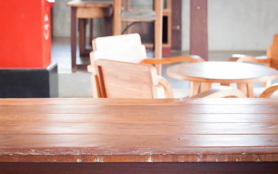 Empty wooden table in coffee shop, stock photo