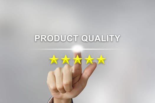 business hand clicking product quality with five stars on screen